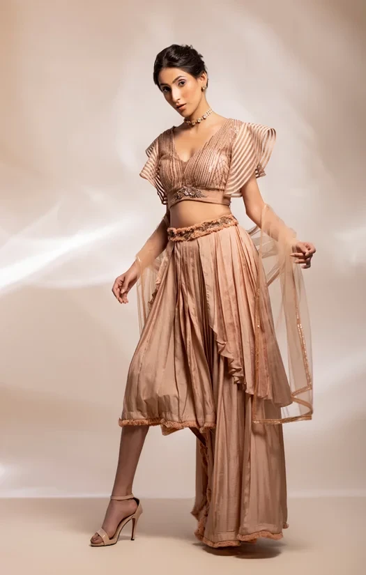 Ruffle asymmetrical skirt , worn with beaded blouse and embellished stole